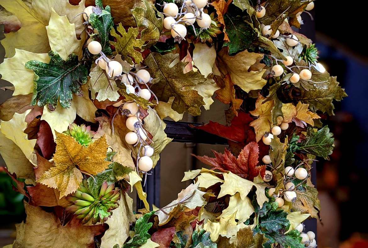 An autumn wreath of dried leaves, seed heads and berries
